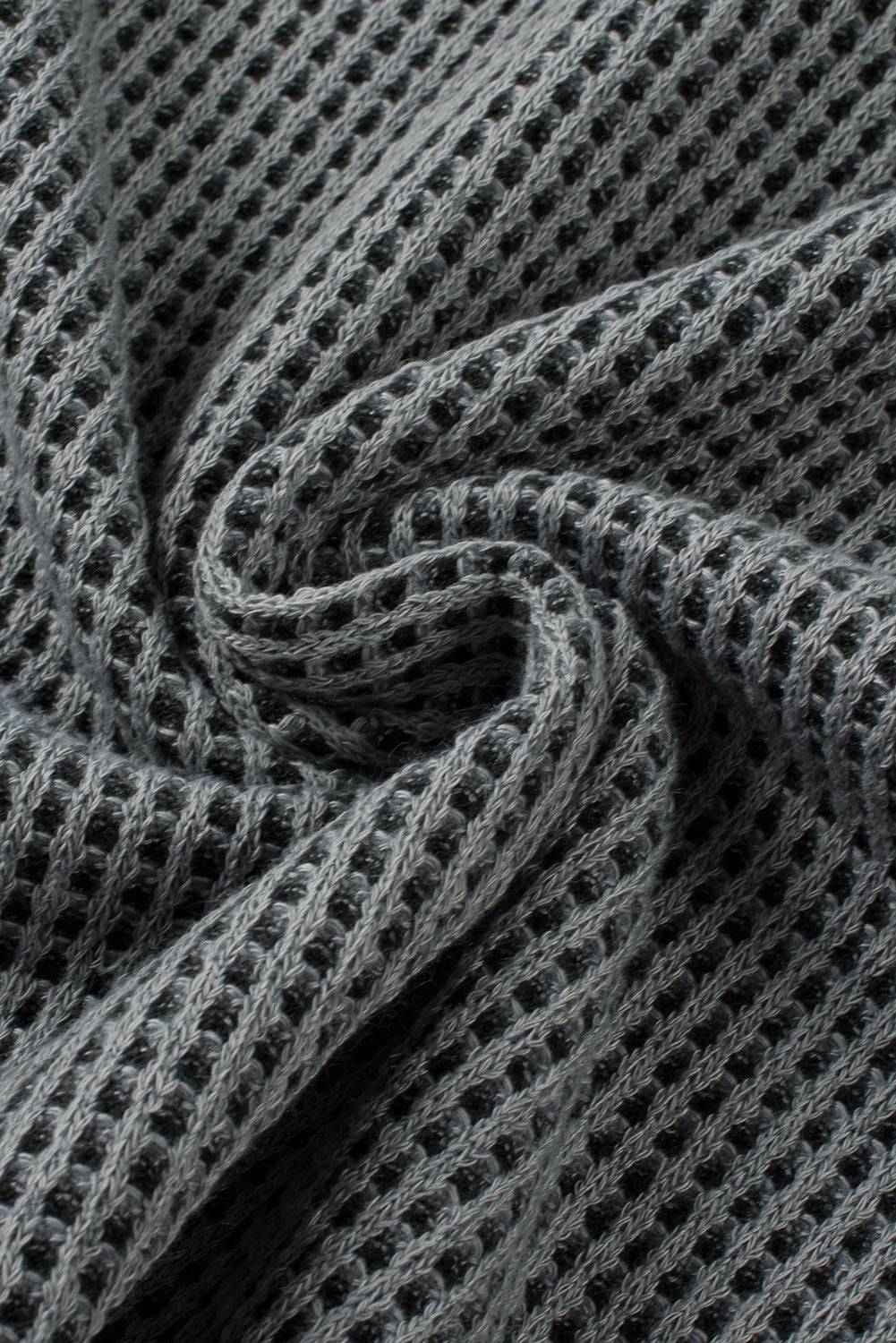 a close up of a gray knitted fabric