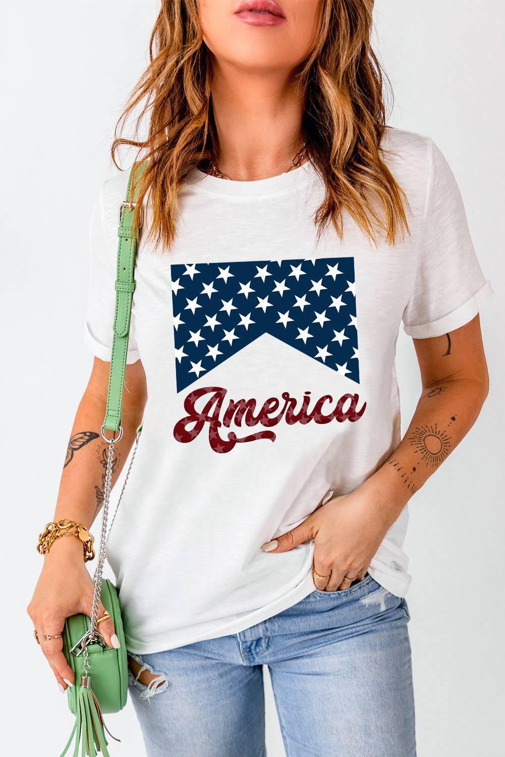 a woman wearing a t - shirt with the american flag on it