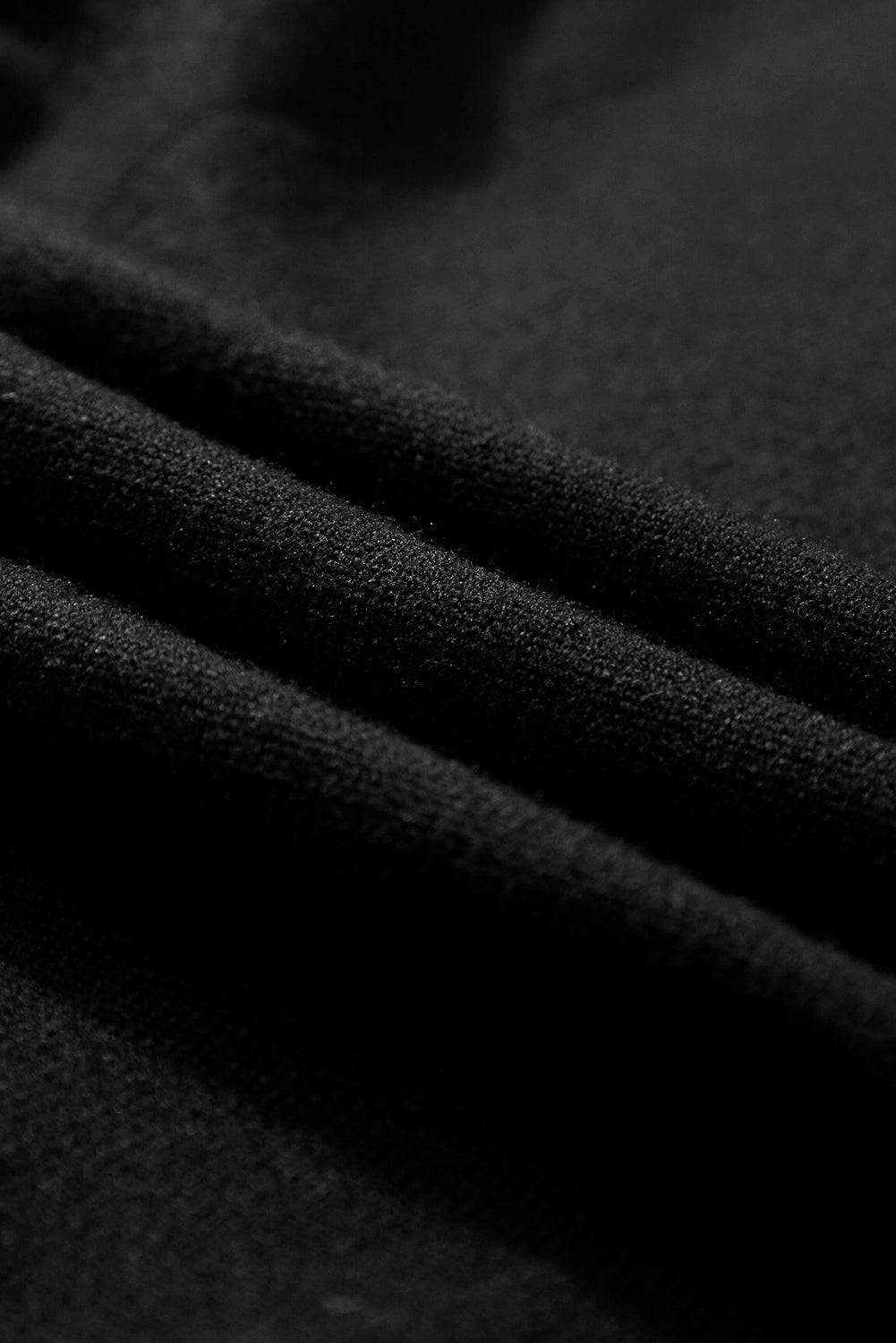 a close up view of a black fabric