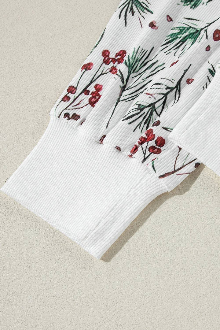 three white napkins with red berries on them