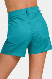 a close up of a woman's shorts with pockets
