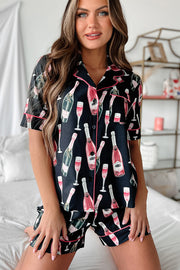 a woman in a short pajama with a bottle of wine on it