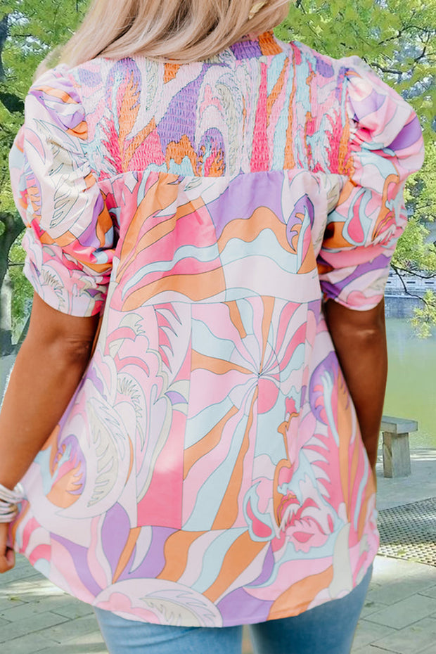 the back of a woman wearing a colorful blouse