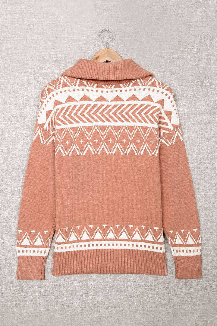 a brown sweater with a white pattern on it