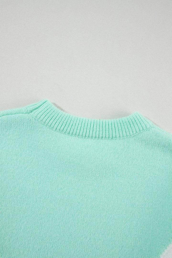 a green sweater with a white stripe on the bottom