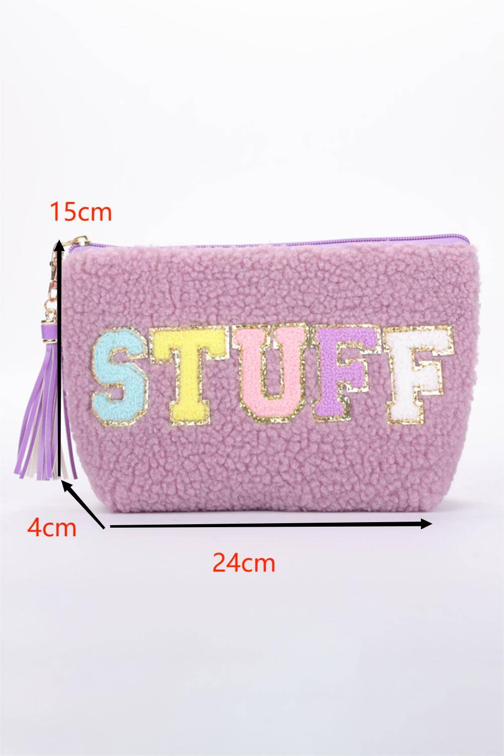 a purple purse with the words stuff on it