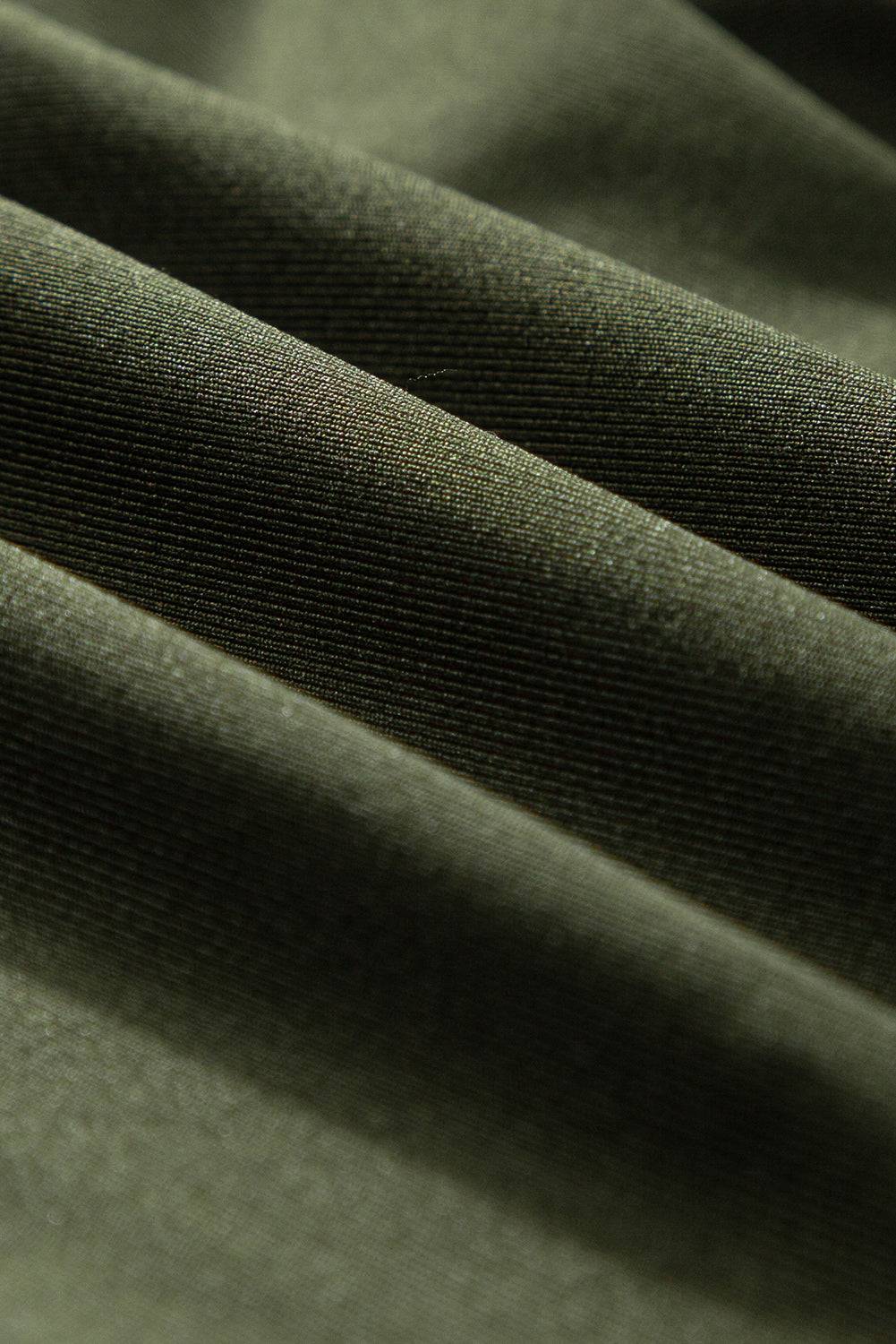 a close up view of a green fabric