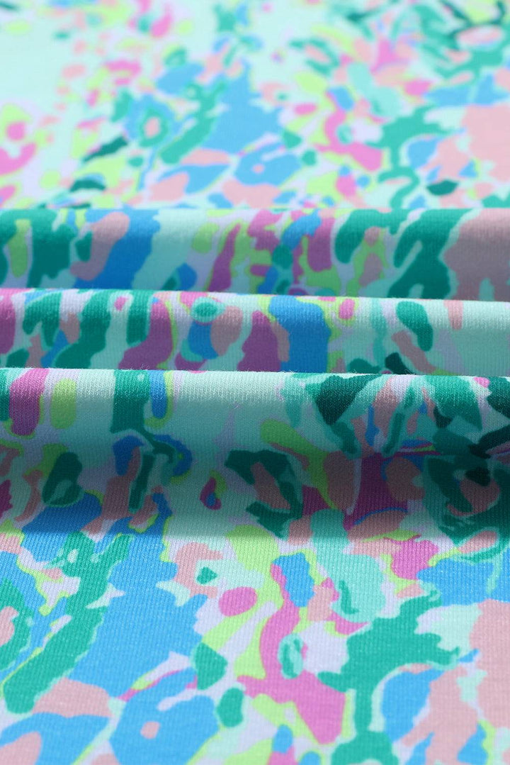 a close up of a colorful fabric with a flower pattern