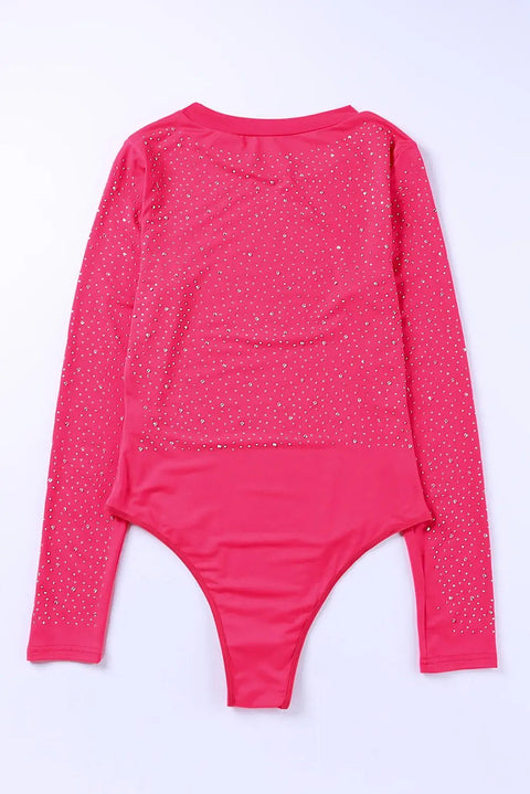 a pink bodysuit with white dots on it