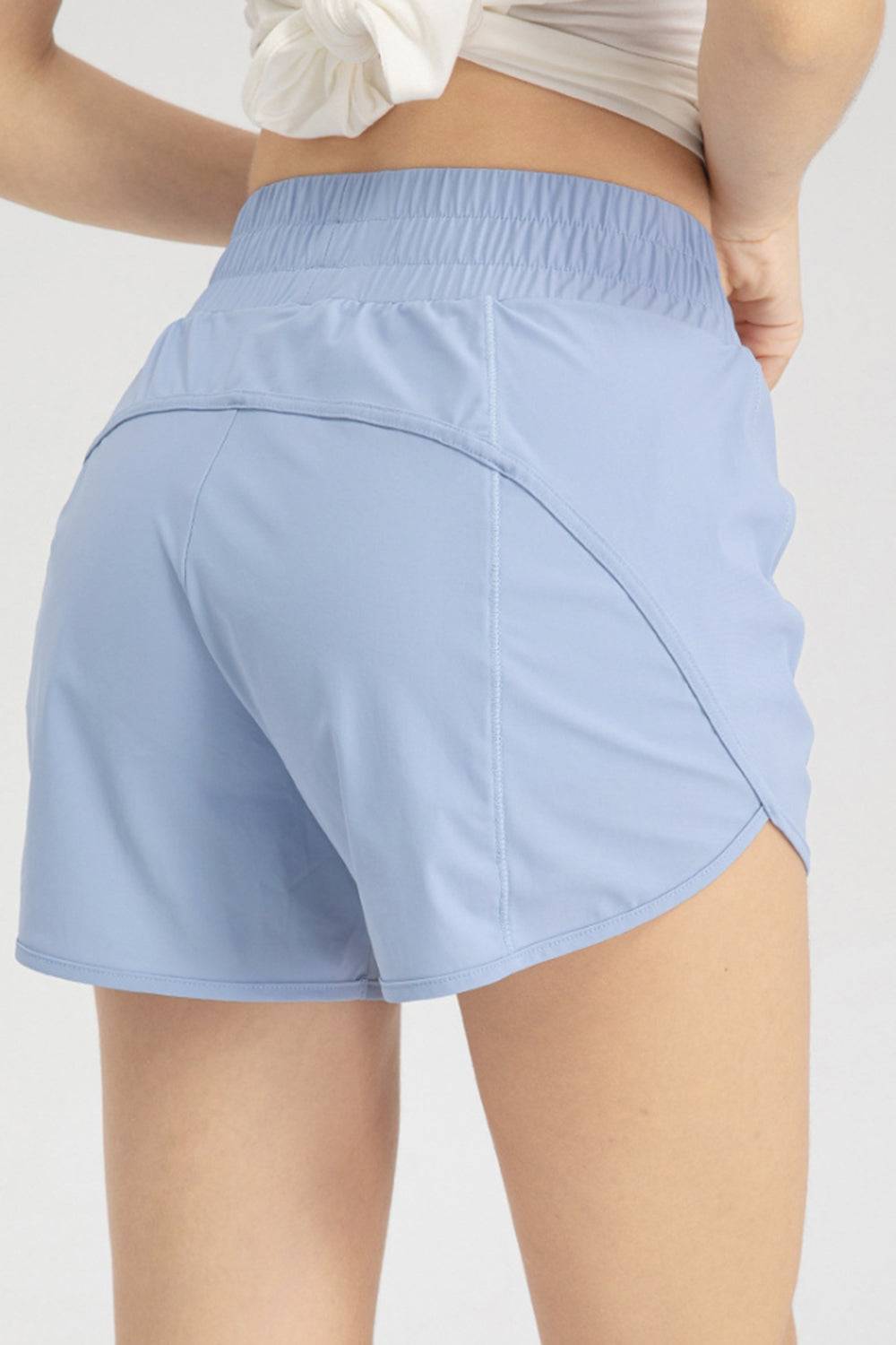 a close up of a person wearing shorts