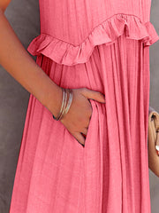 a woman in a pink dress holding a purse