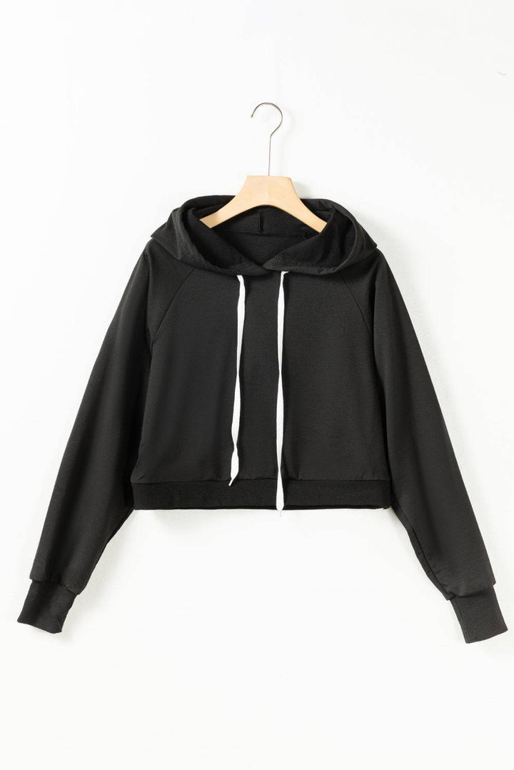 a black crop top with a hoodie on a hanger