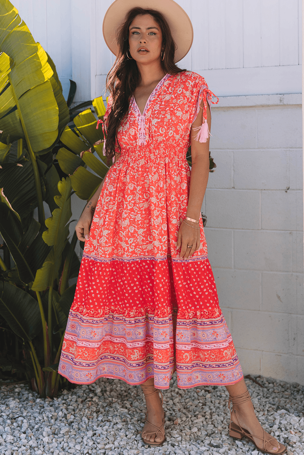 model wearing Red Floral Print Tasseled Tied Sleeve Empire Waist Maxi Dress outdoors, styled with sandals and hat for a vacation-ready look