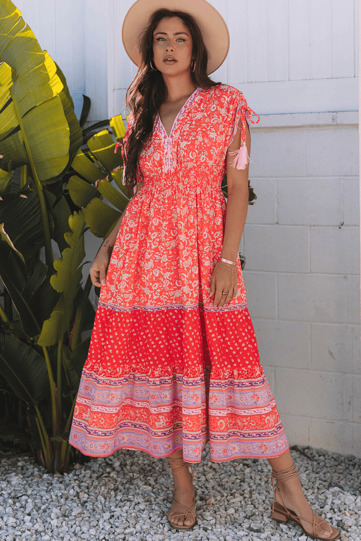 model wearing Red Floral Print Tasseled Tied Sleeve Empire Waist Maxi Dress outdoors, styled with sandals and hat for a vacation-ready look