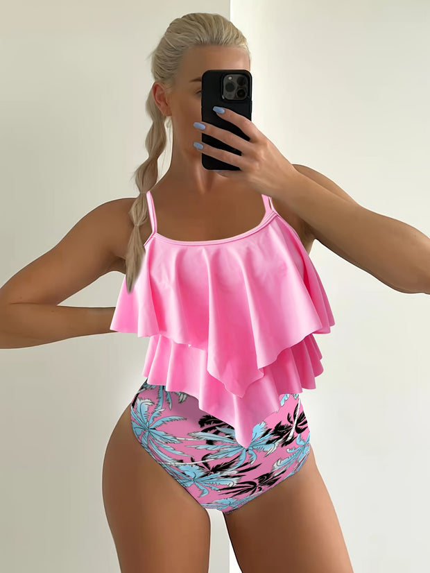 a woman taking a picture of herself in a pink swimsuit