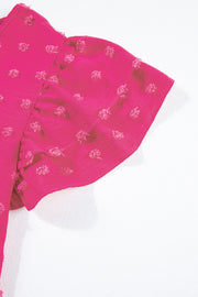 a pair of pink pants laying on top of a white surface