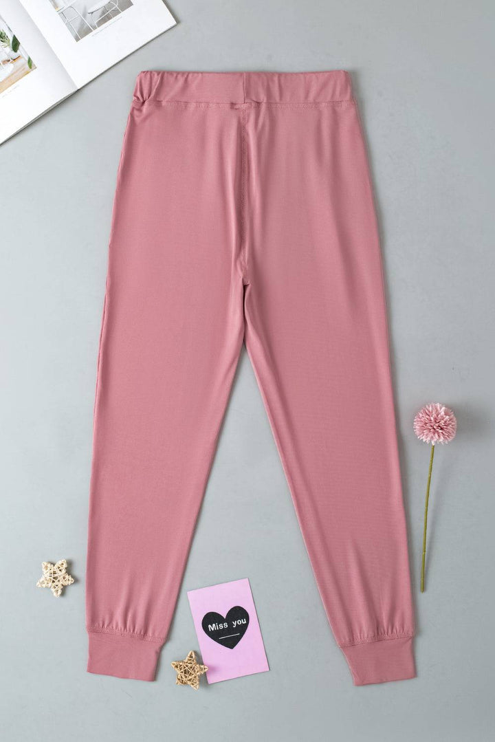 a pink leggings next to a pink flower