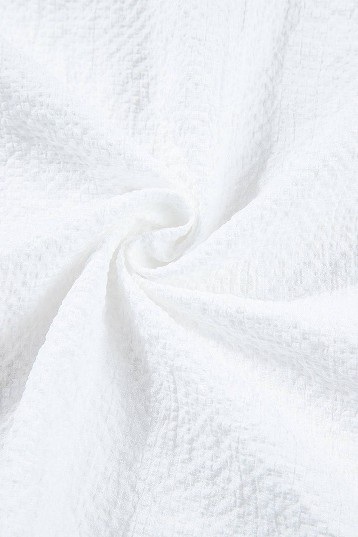 a close up view of a white fabric