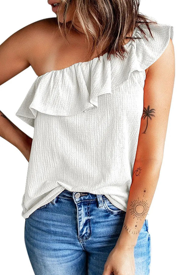 a woman wearing a white top with a palm tree tattoo on her arm