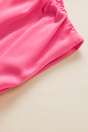 a close up of a pink cloth on a table