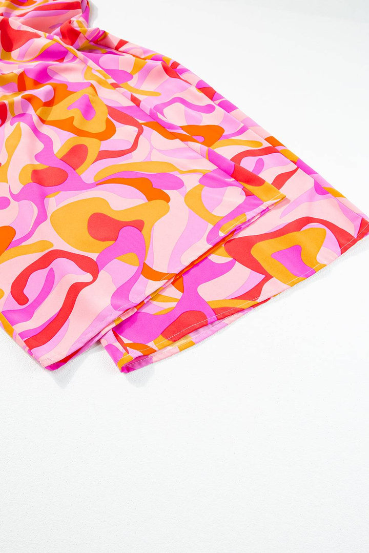 a pair of pink, yellow, and red patterned shorts