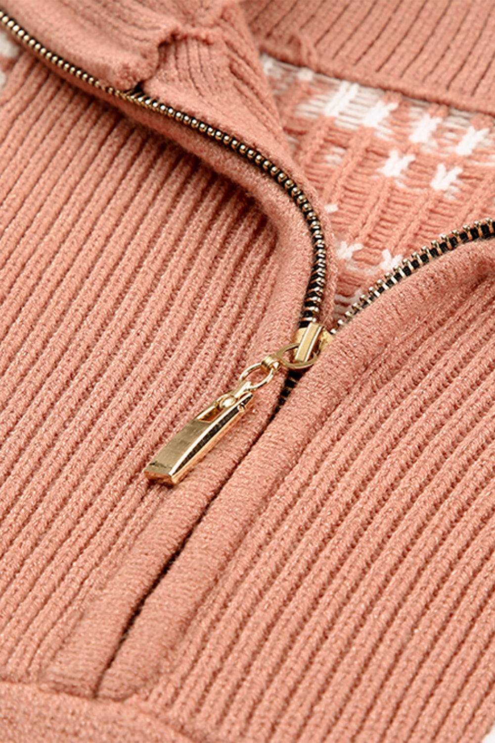 a close up of a pink sweater with a zipper