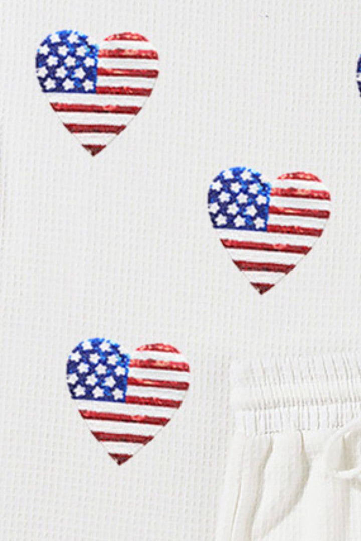 a white shirt with american hearts on it