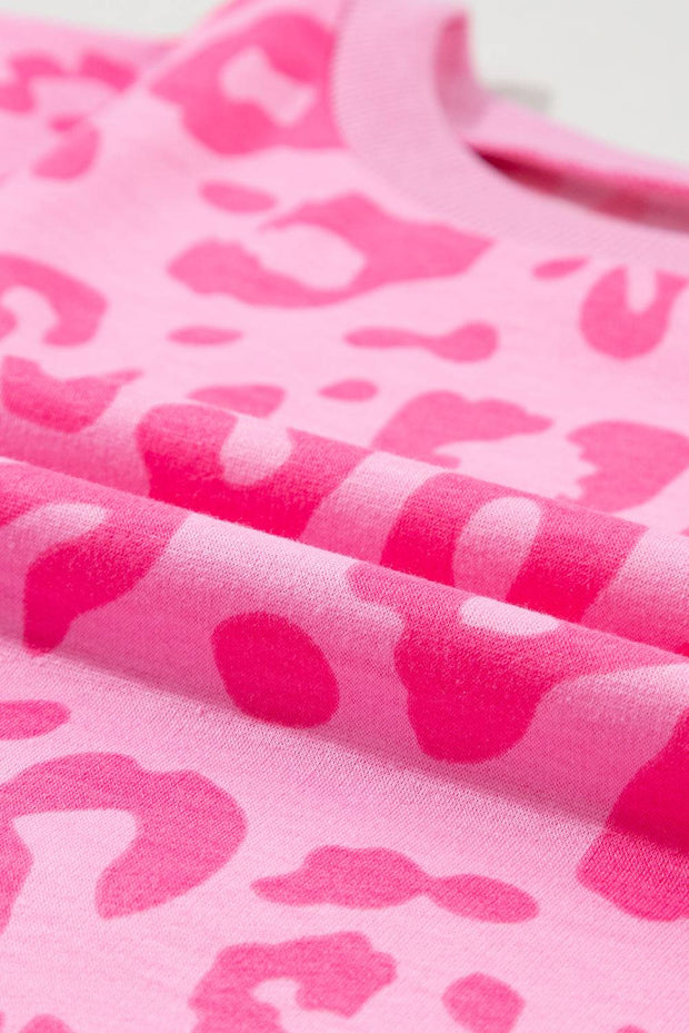 a close up of a pink and white animal print fabric