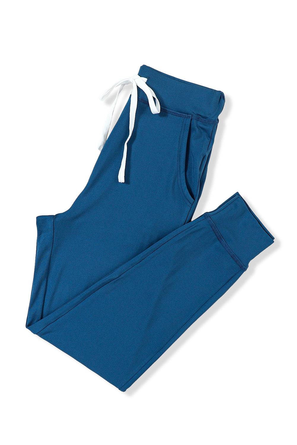 a pair of blue sweatpants with white drawstrings