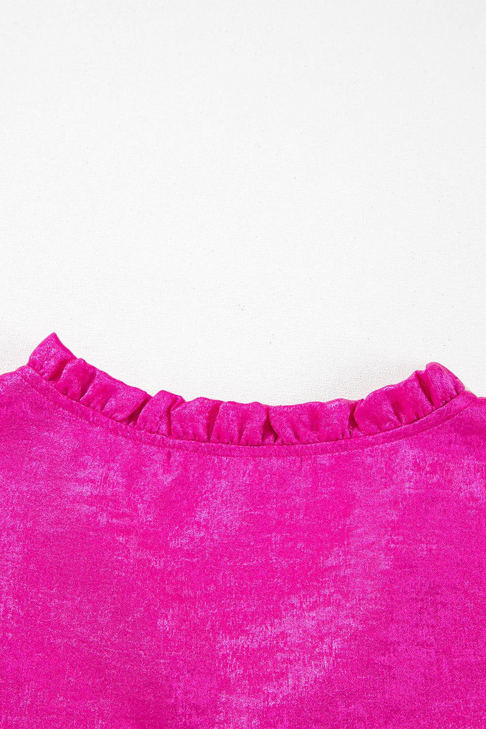 Detail of back neckline on Pink Metallic Frilled V Neck Puff Sleeve Babydoll Blouse, featuring subtle ruffle trim for added elegance.