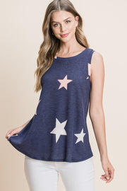 a woman wearing a tank top with stars on it