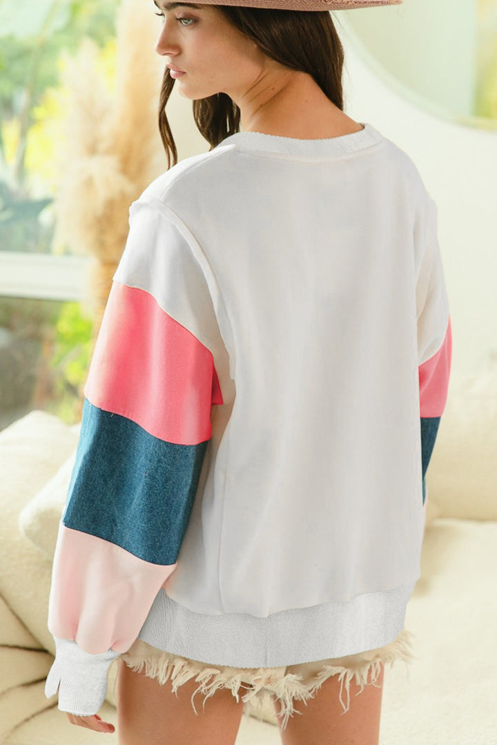 Back view of White French Terry Color Block Long Sleeve Top with soft color block sleeves, ideal for fall casual wear. Shop now at Faith & Co. Boutique.