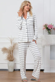 a woman wearing a white and black striped pajama set