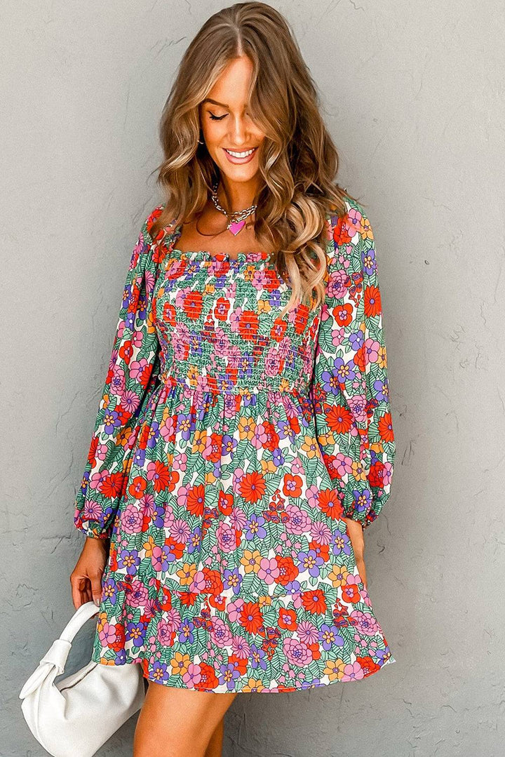 a woman in a floral dress holding a white purse