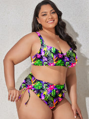 a woman in a colorful bikini top and bottom