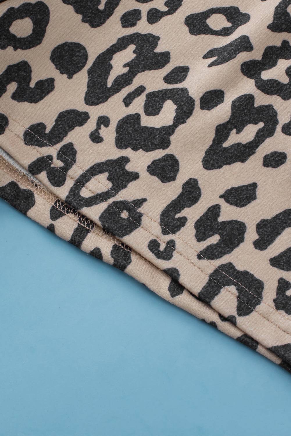 a close up of a blue surface with a black and white animal print on it