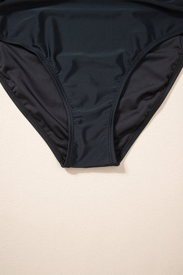 a woman's black bikini top with a black bottom