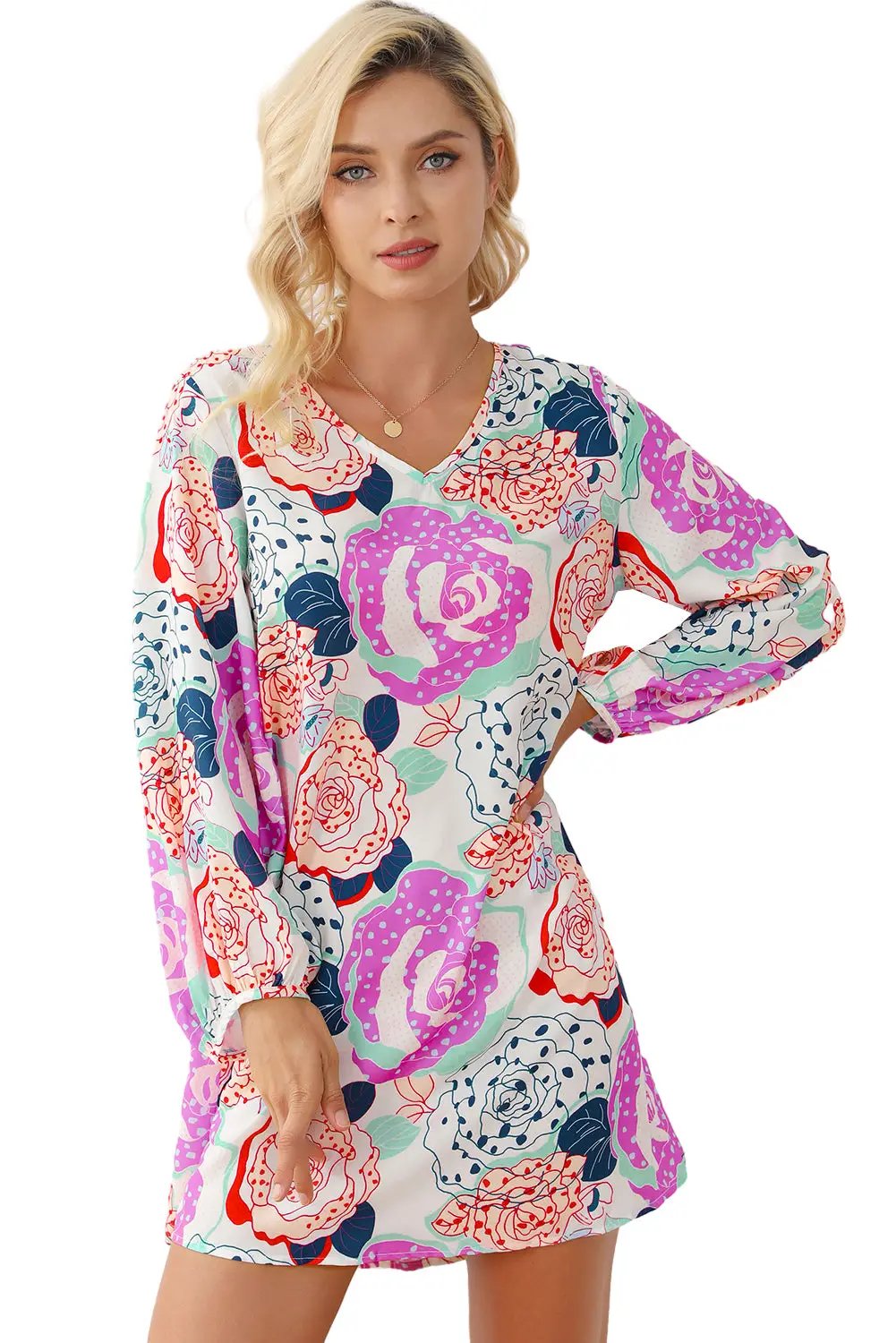 a woman wearing a dress with flowers on it