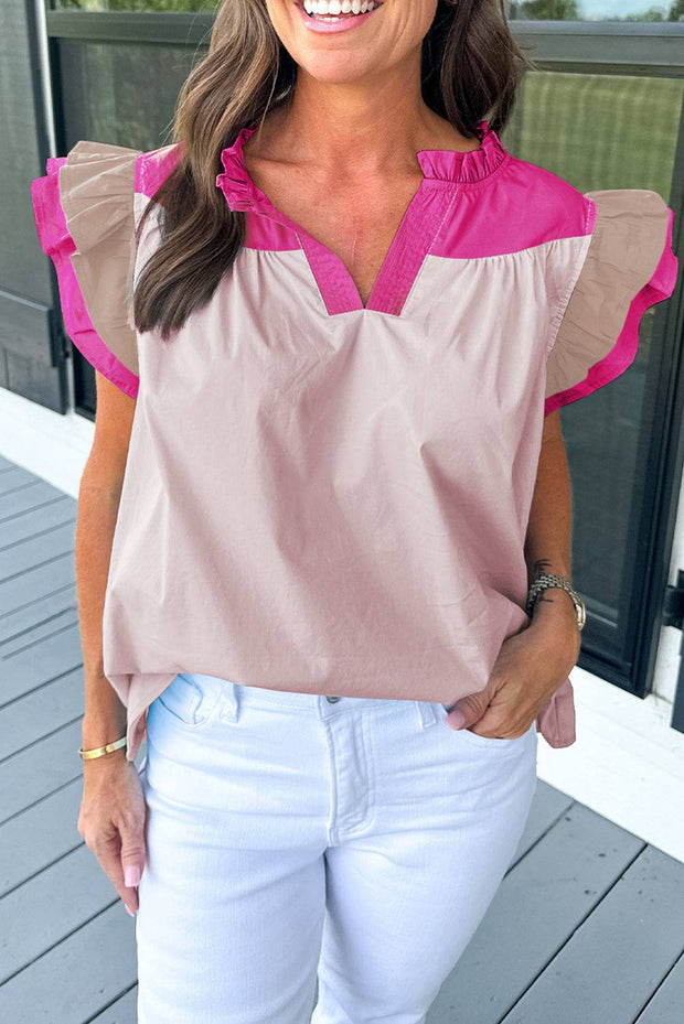 a woman wearing a pink and brown top