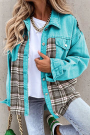 a woman wearing a blue jacket and jeans