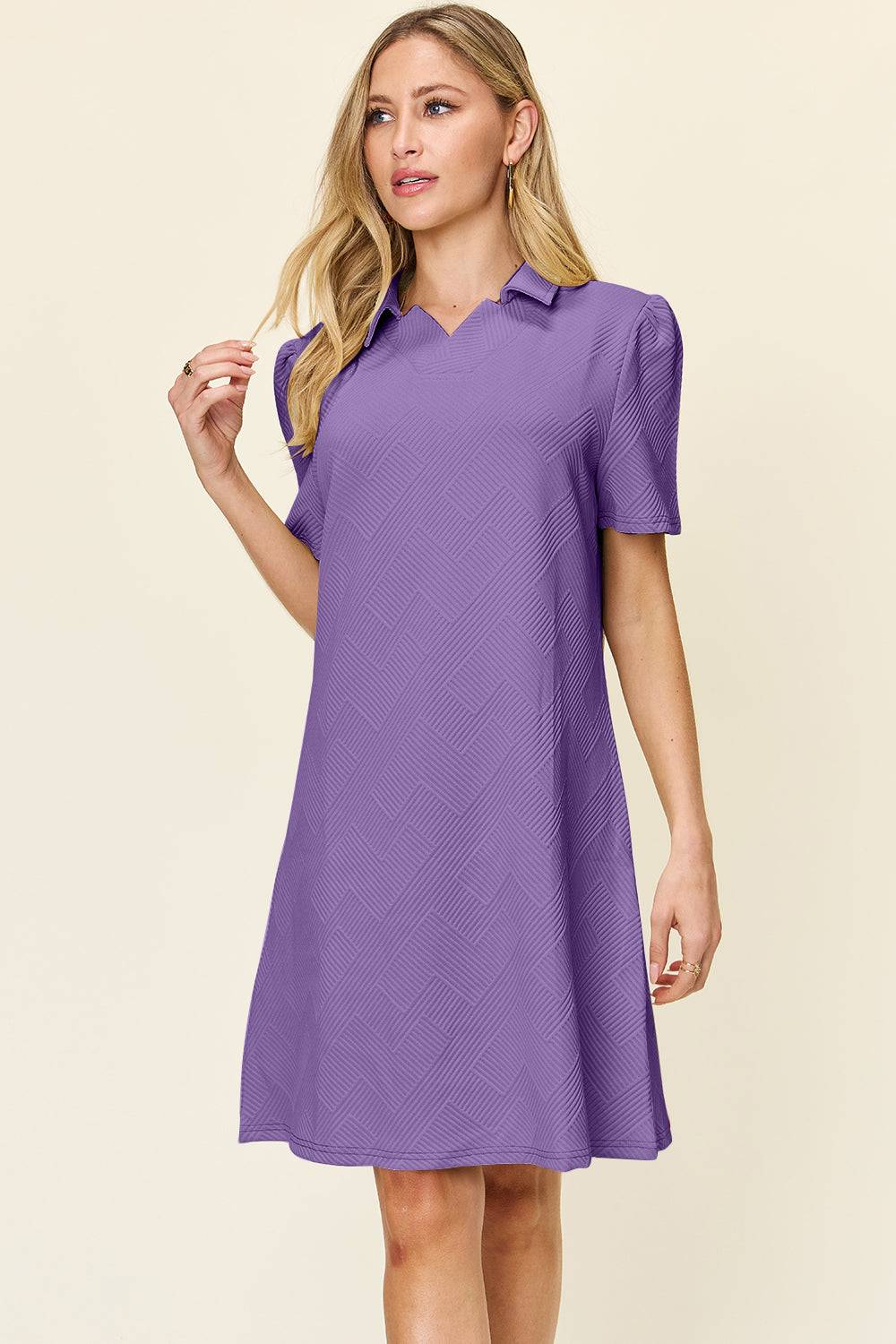 a woman wearing a purple dress