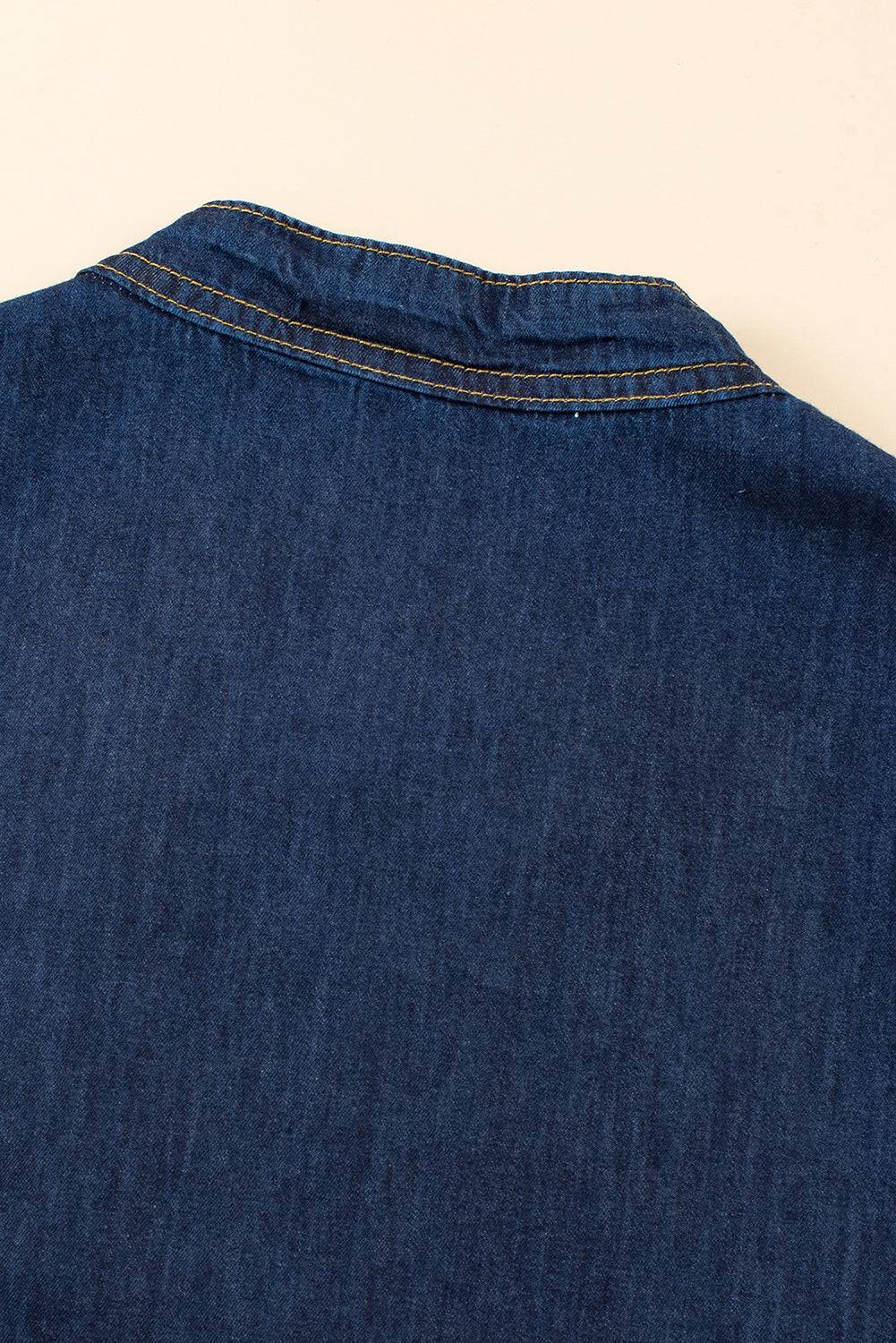 a close up of a blue jean shirt