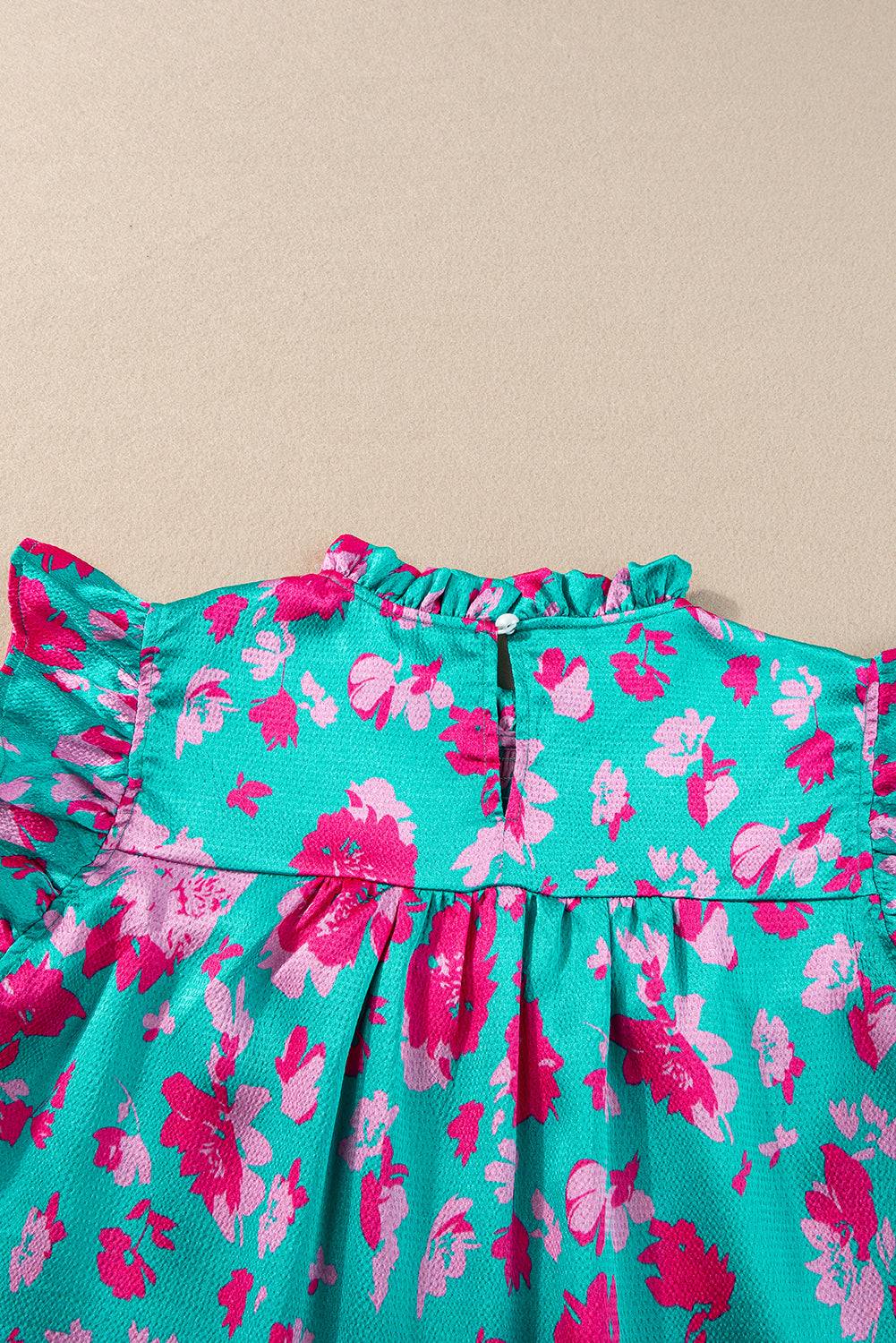 a blue dress with pink flowers on it