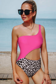 a woman in a pink top and leopard print shorts