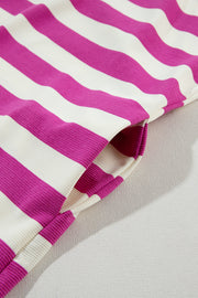 a close up of a pink and white striped fabric