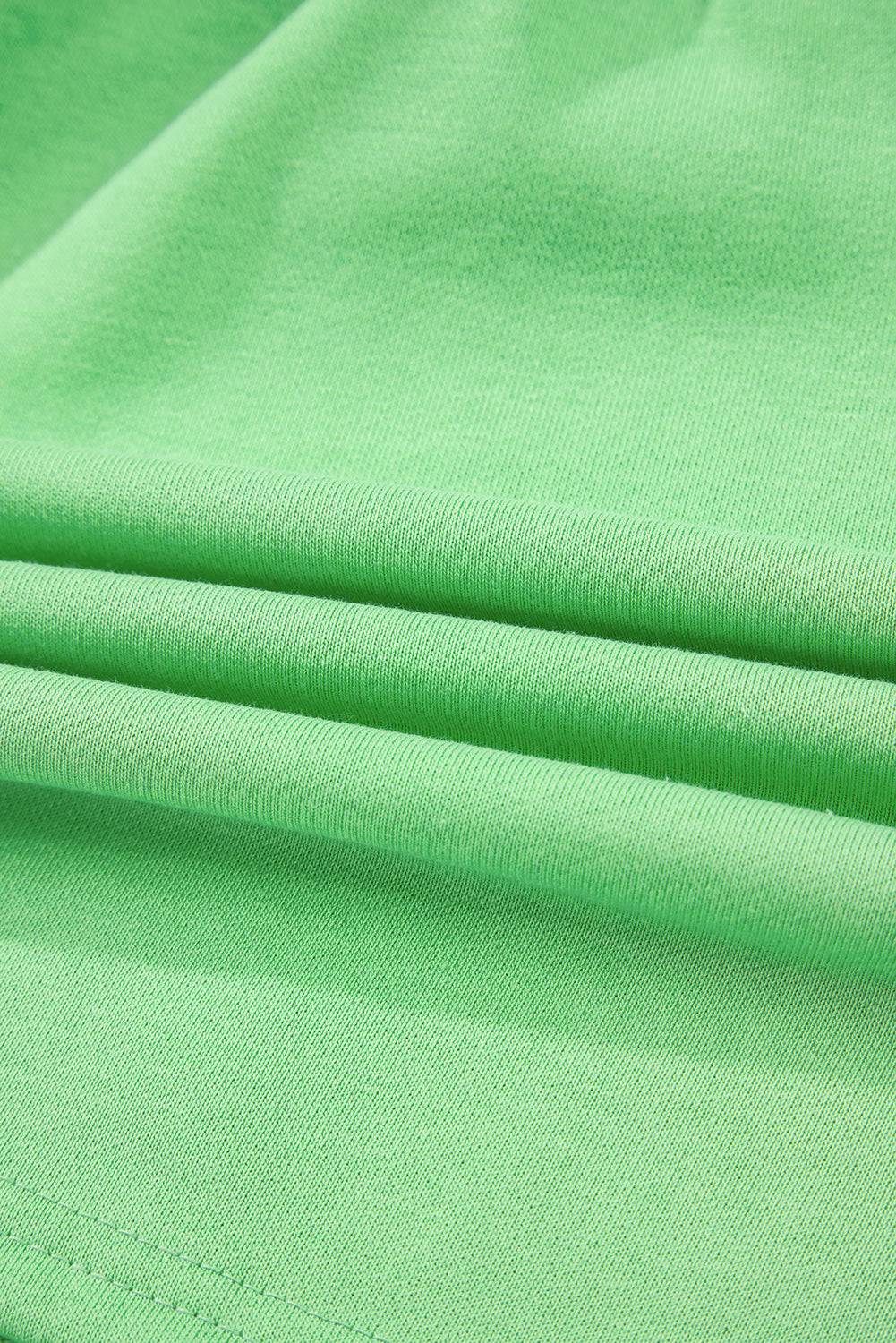 Close-up of soft French Terry fabric in light green, highlighting texture and material quality of mini skort at Faith & Co. Boutique.