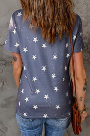 the back of a woman's shirt with white stars on it