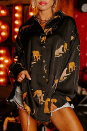 a woman wearing a black shirt with yellow elephants on it