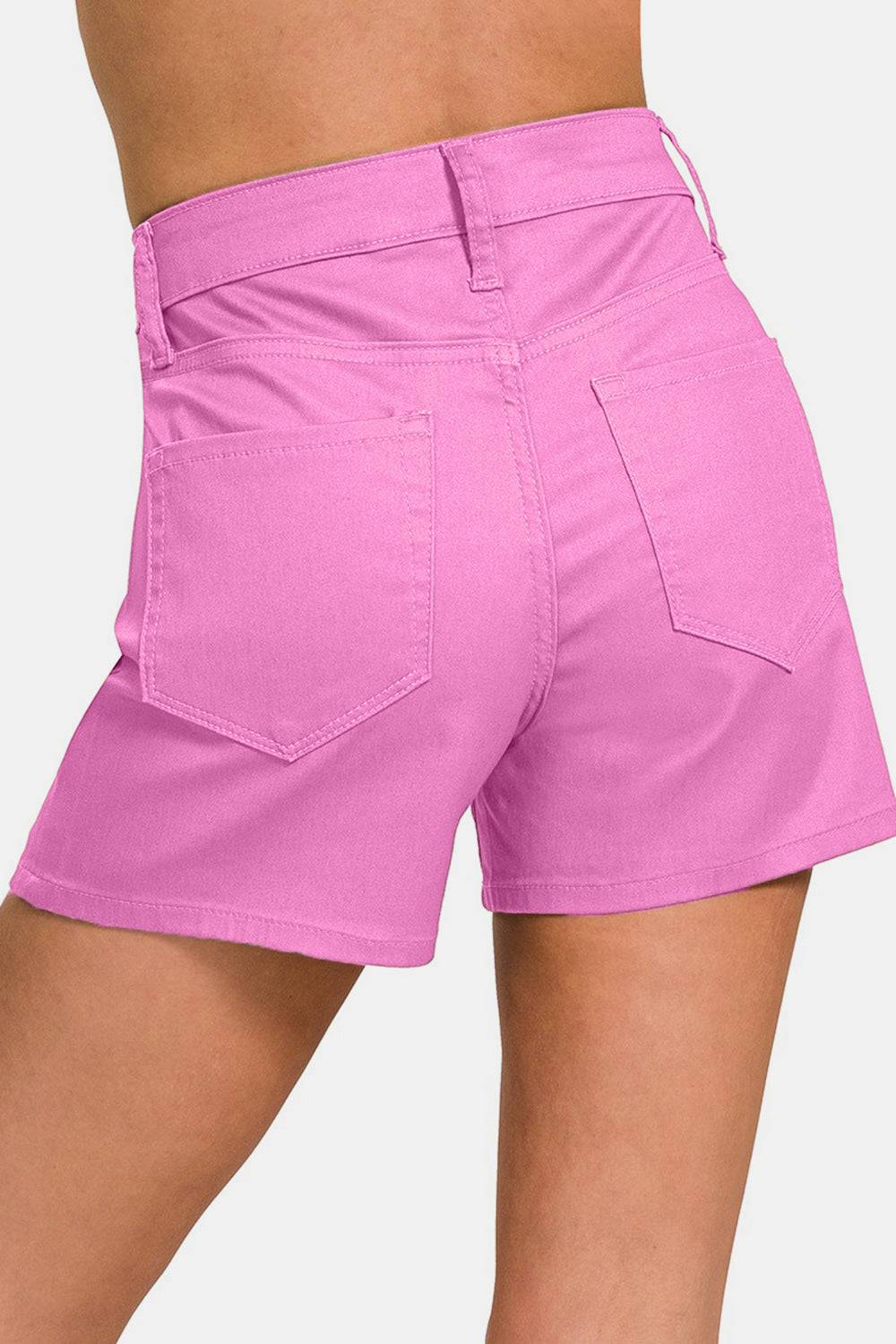 a close up of a person wearing pink shorts