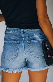 a close up of a person holding a purse